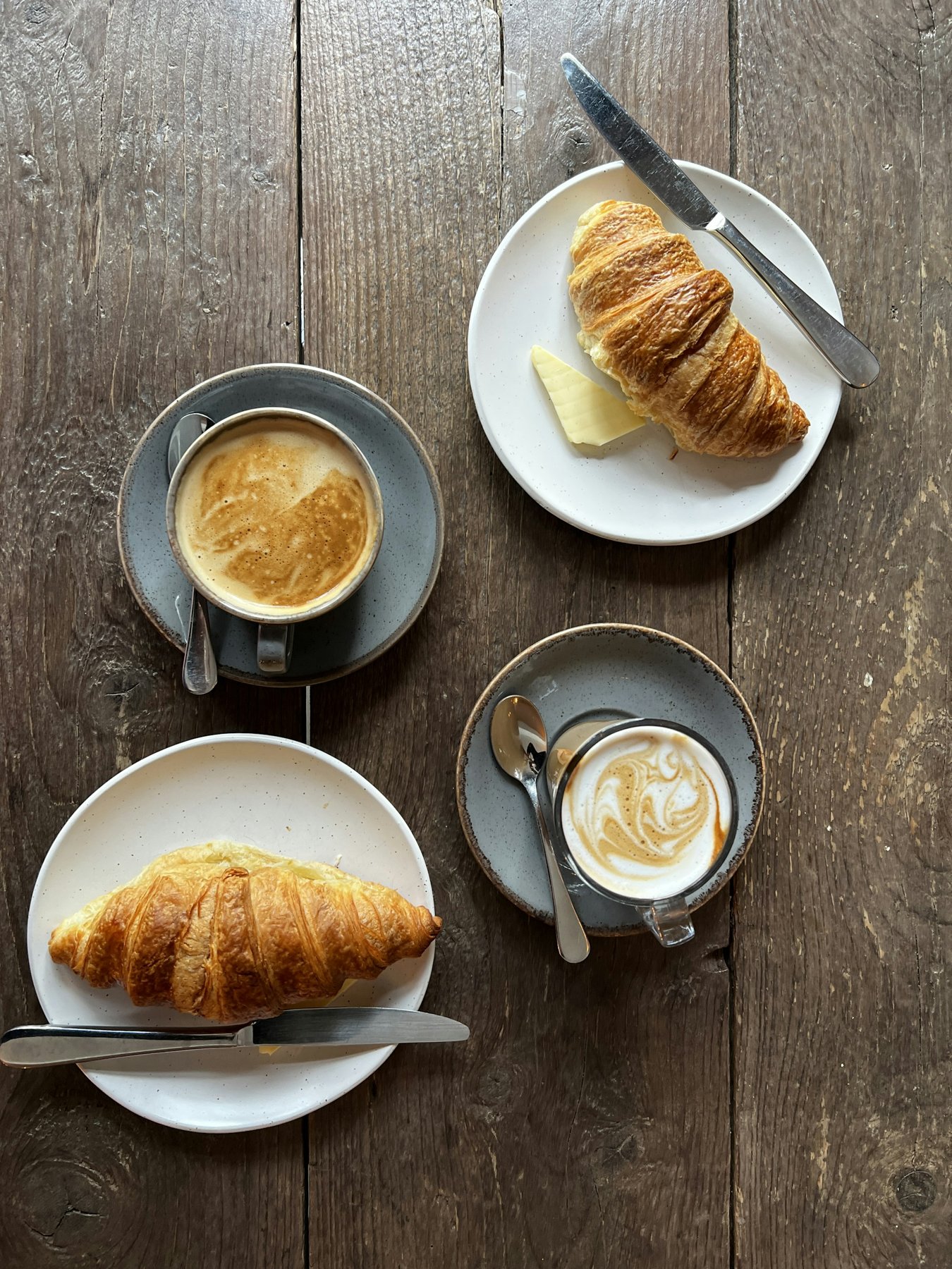 Coffee and fresh pastries on a café table